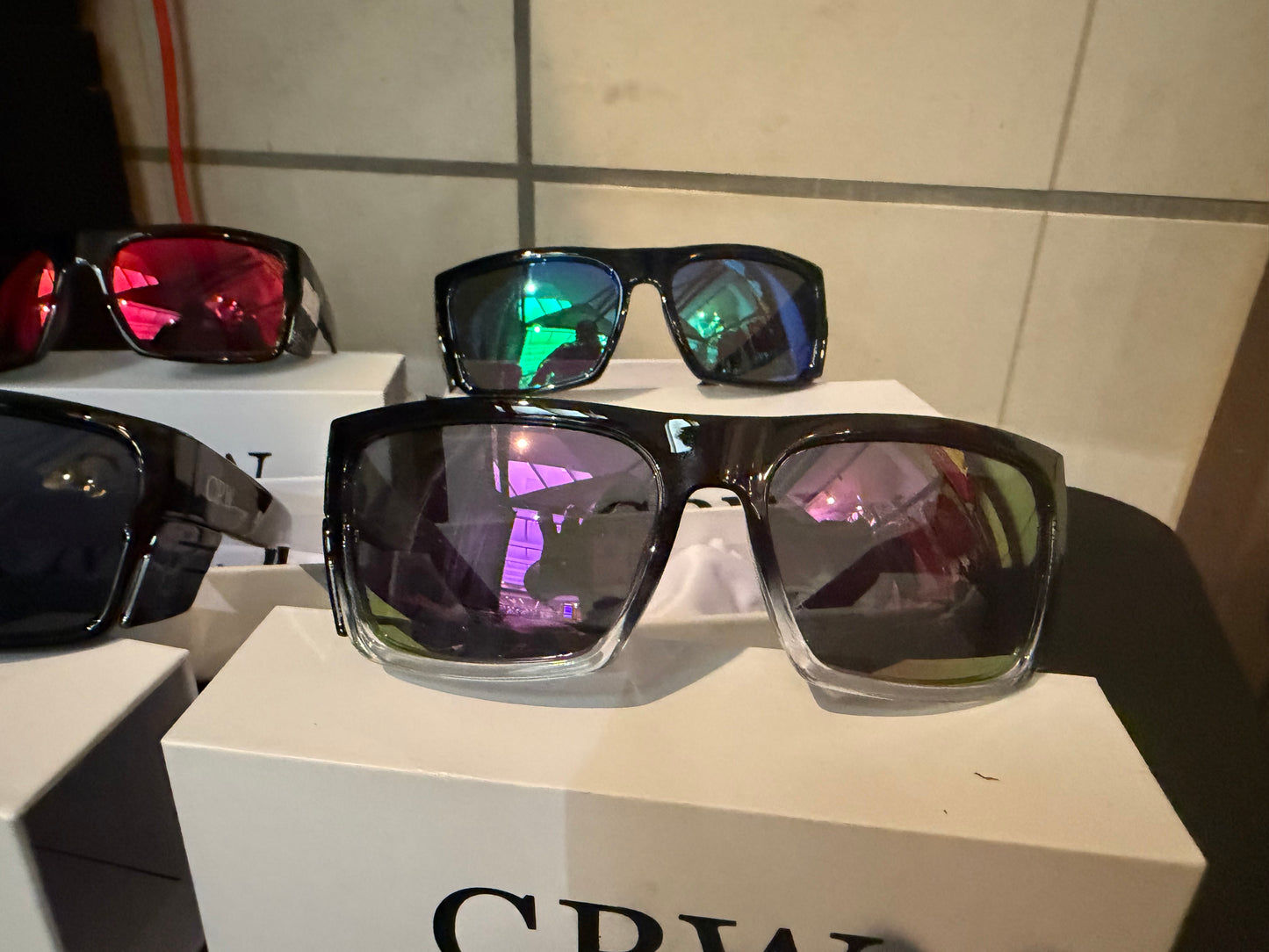 Black/clear frame. Purple lenses